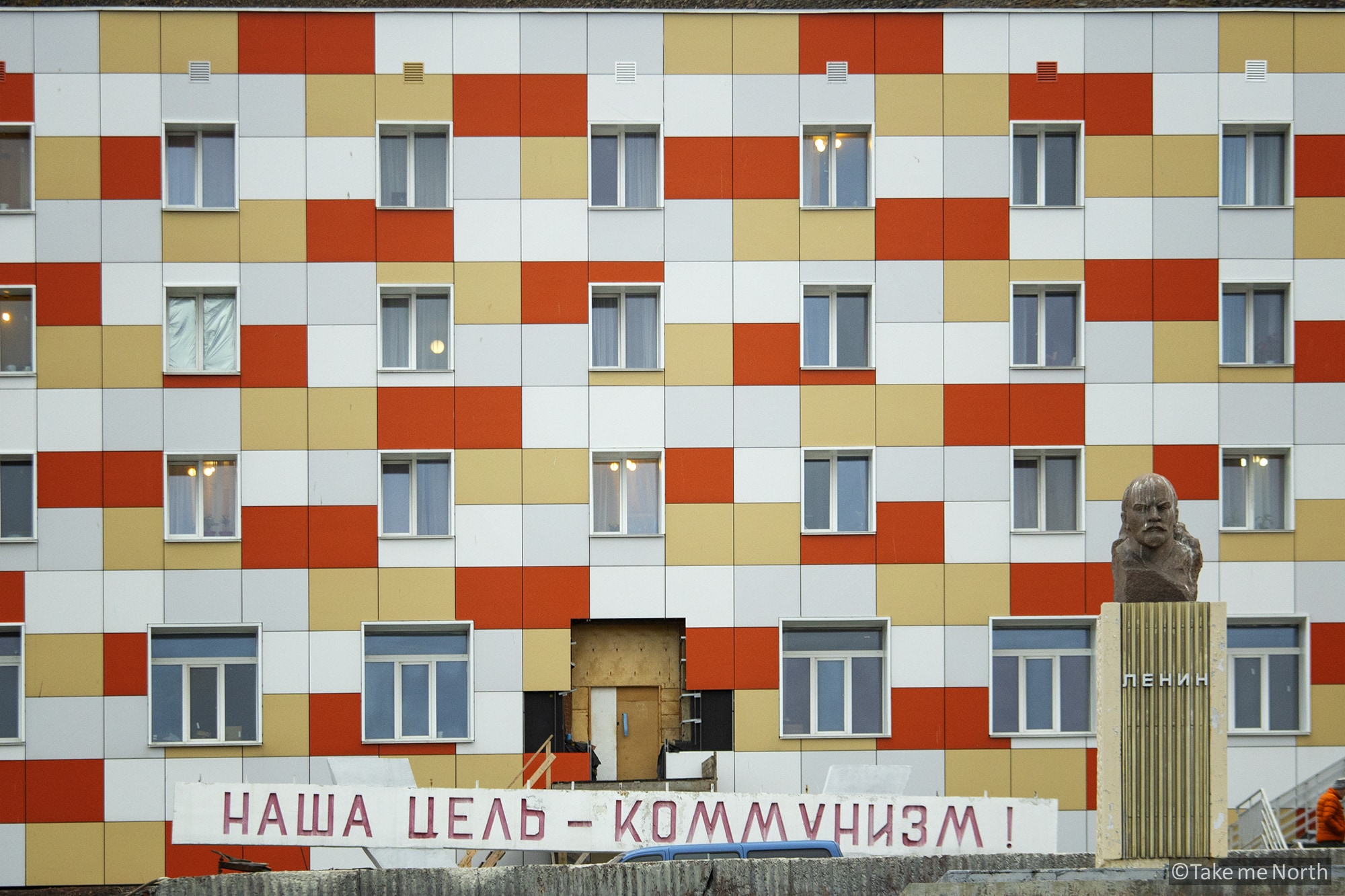 One of the residential buildings that recently got a facelift, while Lenin still oversees the square