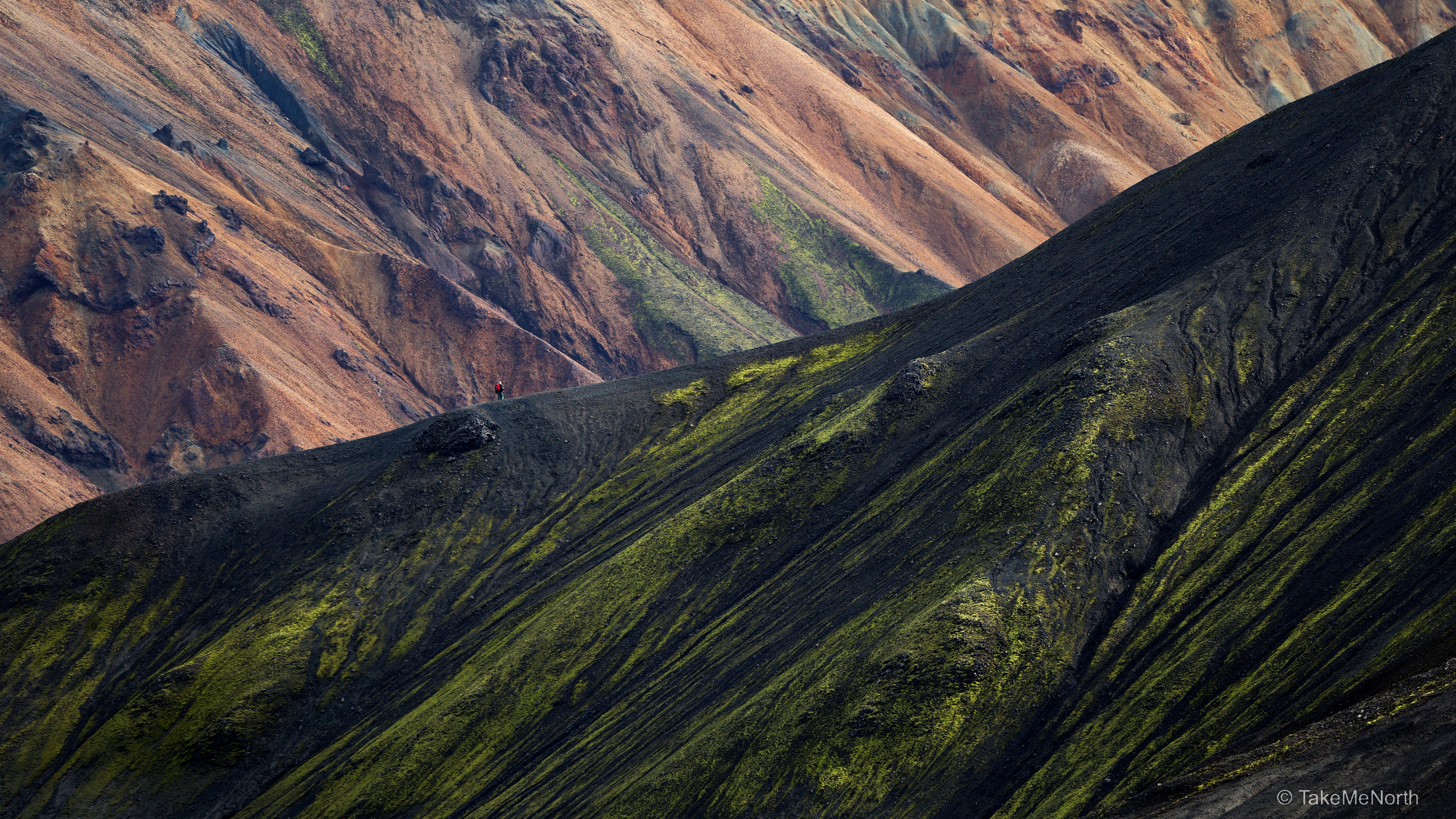 A solitary hiker at the slopes of Bláhnjúkur, the ‘Blue peak’
